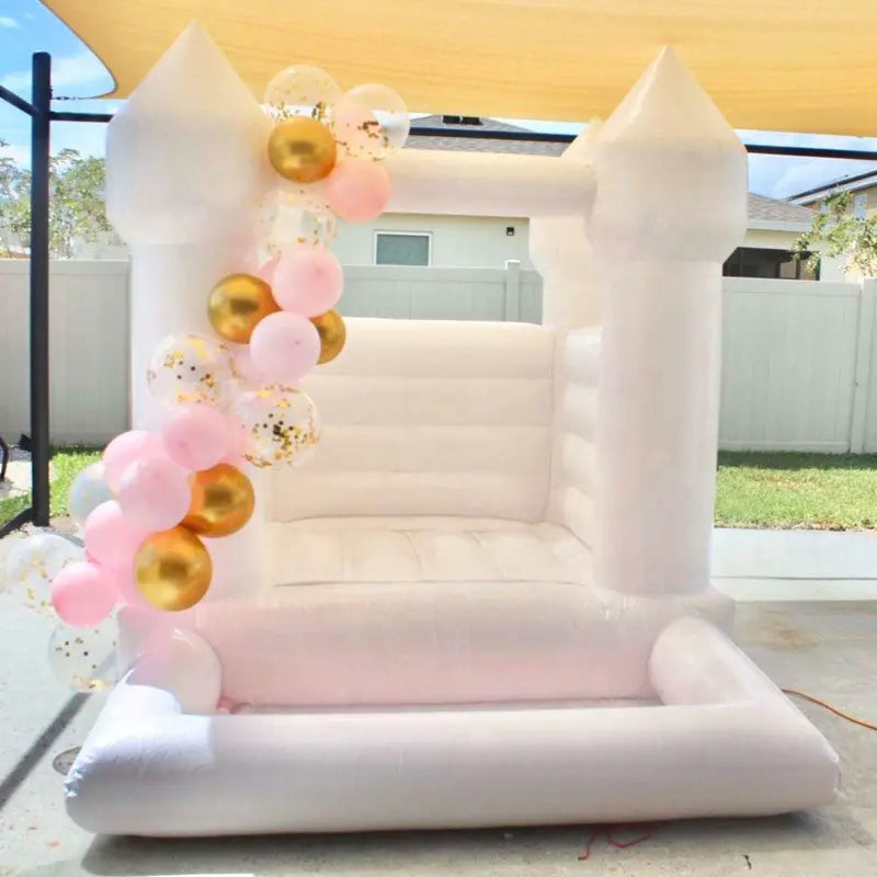 white bounce house with ball pit